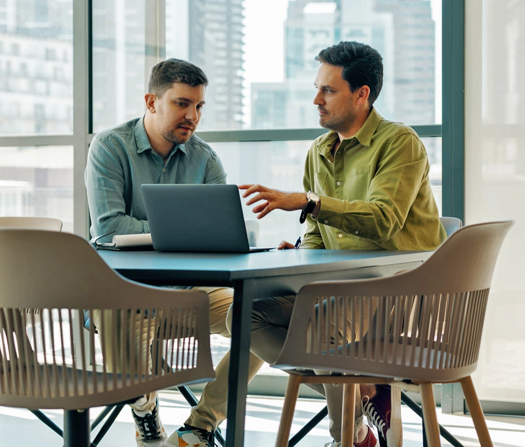 Two Employees Working at Table
