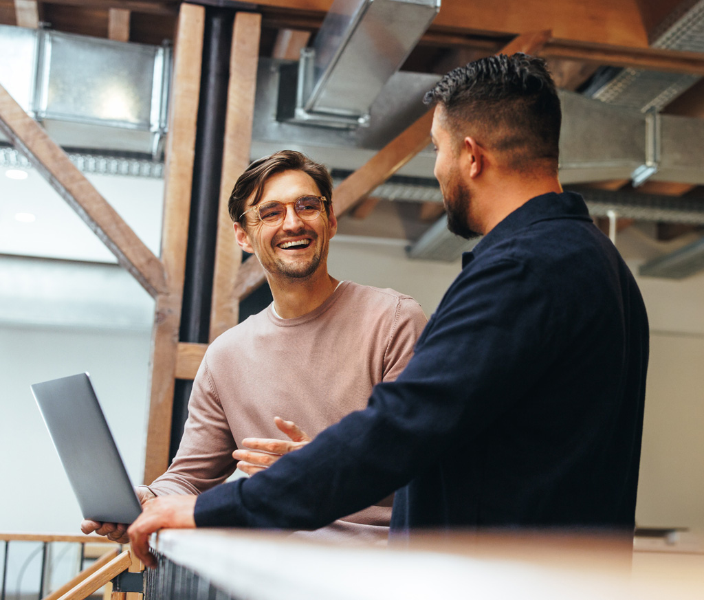 Two Employees Working with Laptop