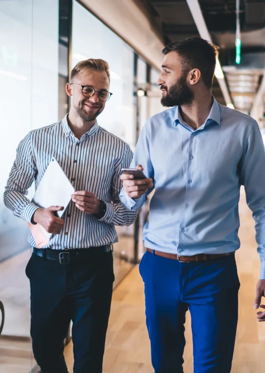 Two Employees Walking and Talking